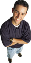 Picture of a gay boy of European descent with brown hair and a big smile